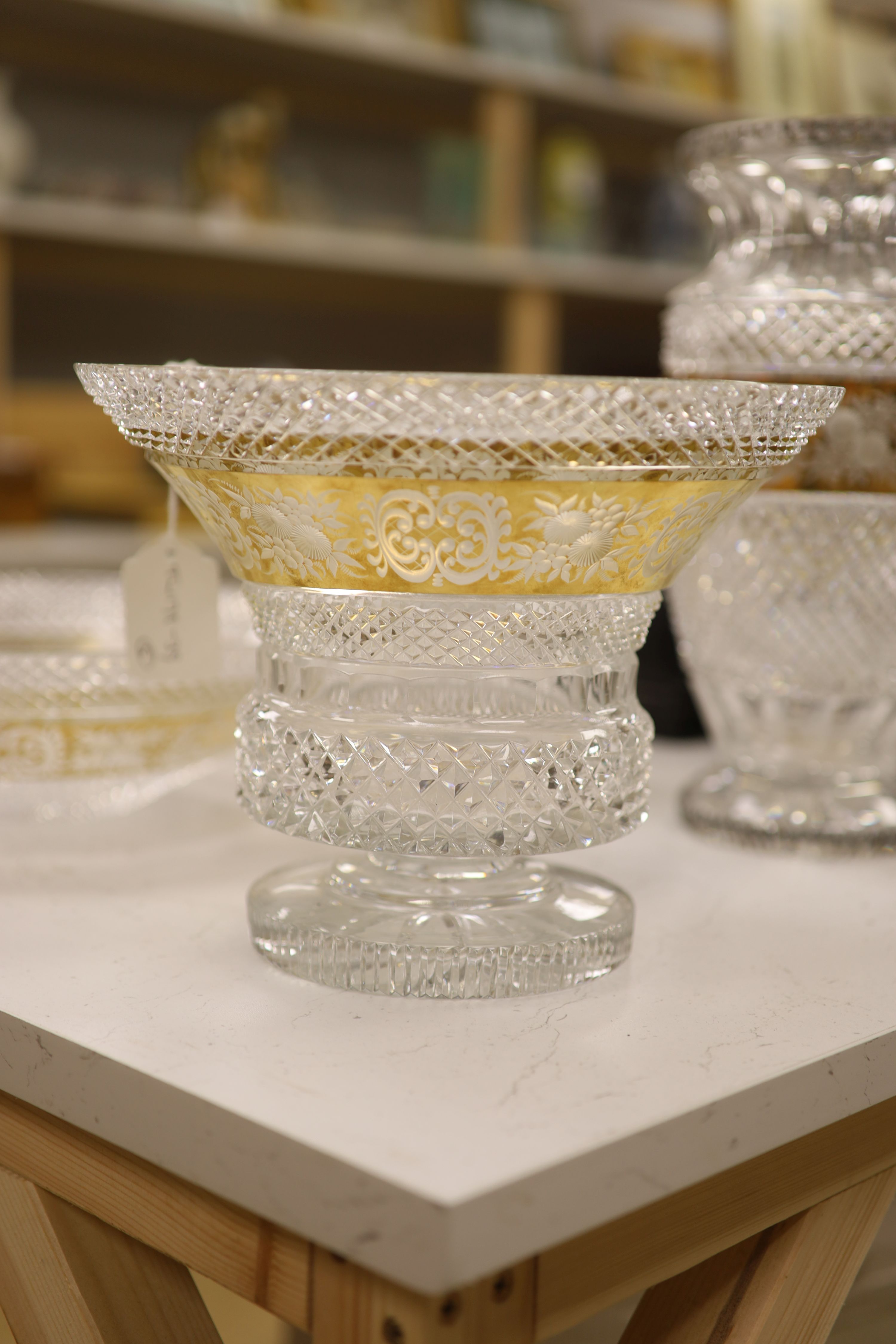 A Moser style tall tapered cut glass vase heightened in gilt, a similar circular bowl, a pedestal bowl and two St Louis tumblers
